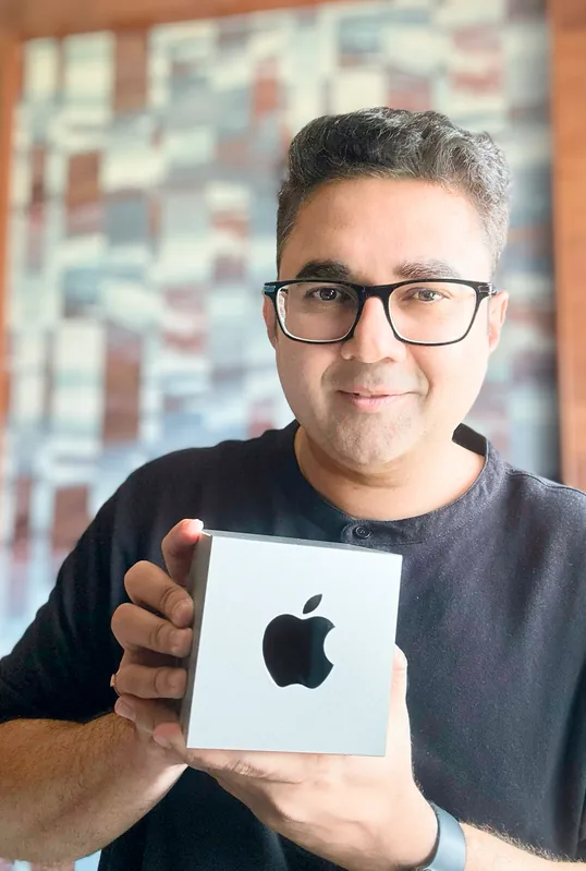 Sandeep holding the Apple Design Award